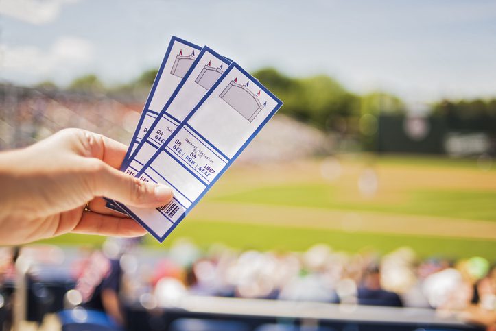 Martinson & Carter, CPAs, PA | hand holding sports event tickets
